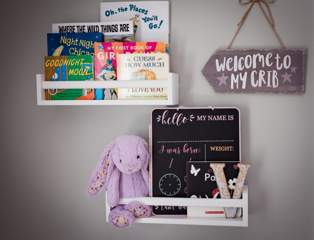 Pictures of books and bunny in newborn baby's nursery