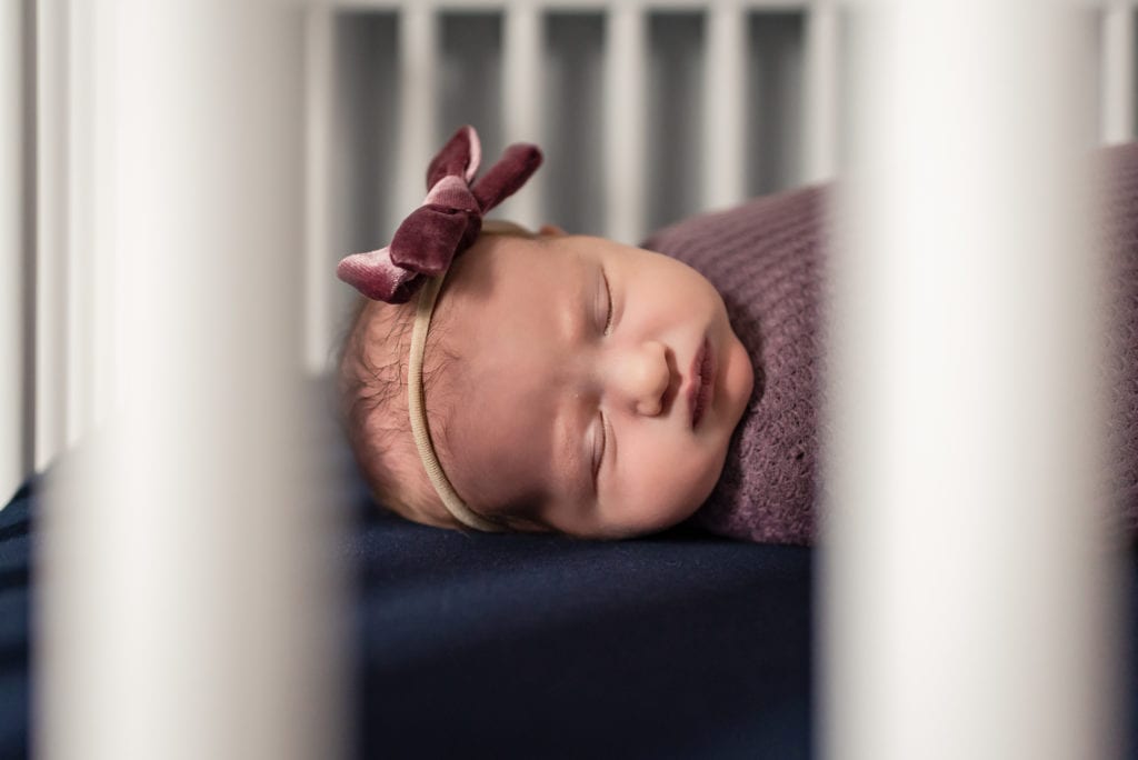 Baby sleeping in her crib West Hollywood Newborn Pictures