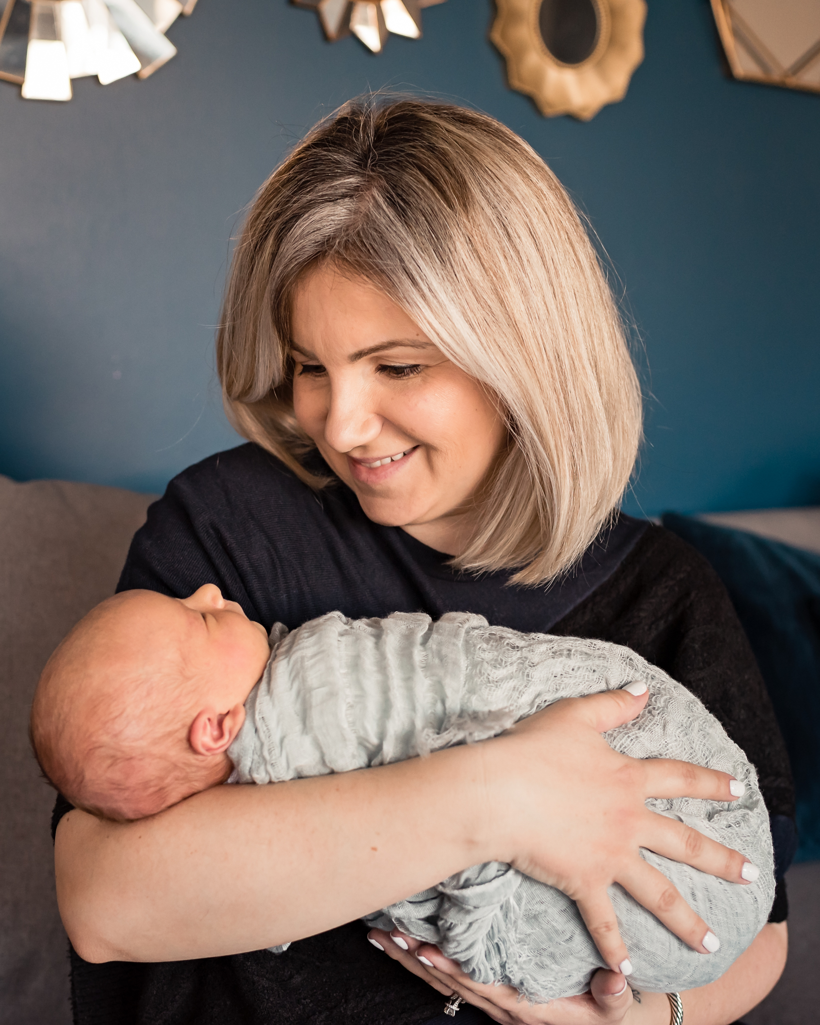 close up of mom holding baby at an in home session Valley Village Newborn Pictures